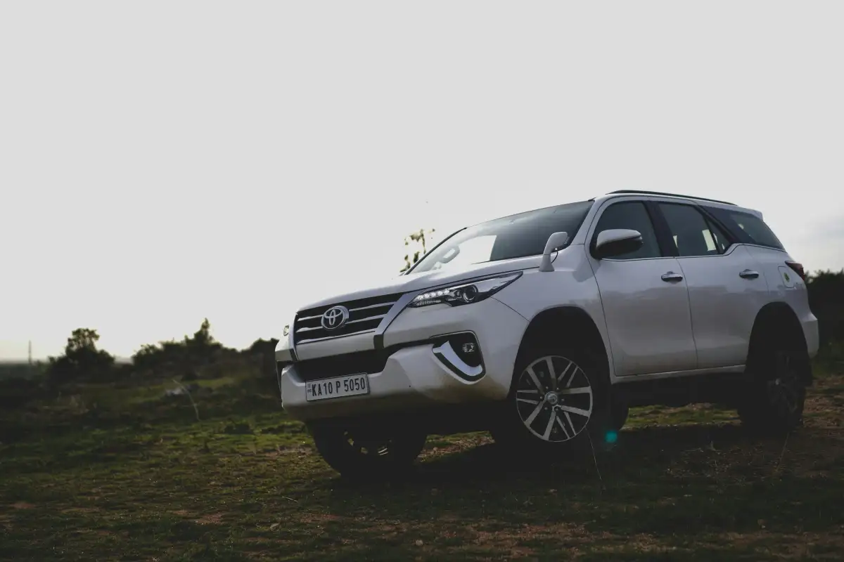 a car parked on a dirt road